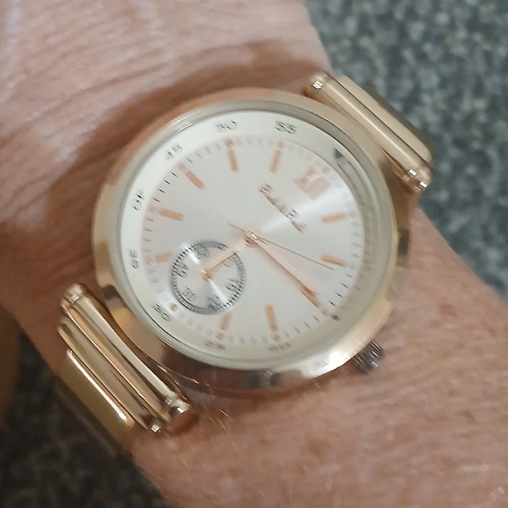Peck & Peck rose gold tone with white face women's open cuff watch